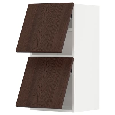 Dark brown wooden kitchen cabinets with white frames, angled view.