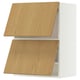 METOD kitchen unit. Light wood doors, white frame.