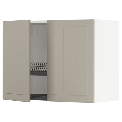 A beige METOD kitchen wall cabinet with one door open, revealing a steel dish rack.