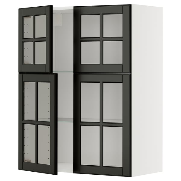 Modern kitchen unit with black glass doors and white shelves.