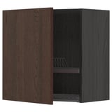 Dark brown wooden kitchen cabinet with open door showing shelf and dish rack.