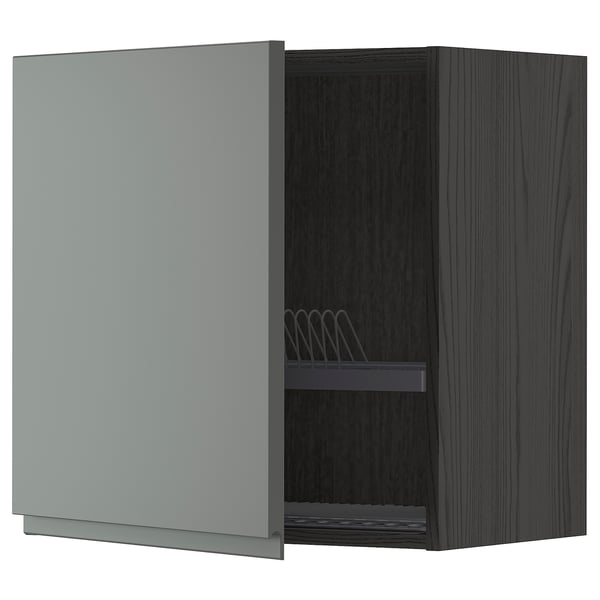 A modern, dark grey kitchen cabinet with a light grey door slightly ajar, revealing a dish drainer inside. It a sleek, contemporary design.