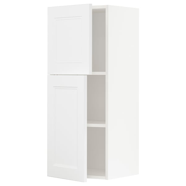 A white METOD kitchen cabinet with adjustable shelves and hinged doors, featuring a modern design.