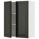 A black METOD kitchen wall cabinet with a bevelled edge door. Its rectangular, with two open doors revealing an adjustable shelf.