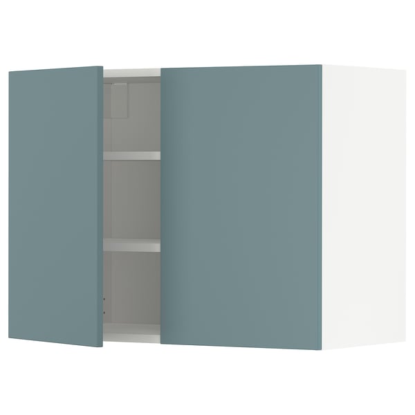 Turquoise METOD kitchen cabinet with adjustable shelves.
