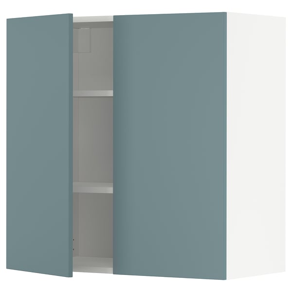 METOD kitchen unit in turquoise with one open cabinet showing shelf inside.