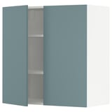 METOD kitchen unit in turquoise with one open cabinet showing shelf inside.