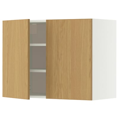 A wooden kitchen cabinet with light oak doors and multiple shelves.