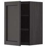 Black stained wooden kitchen cabinet with one adjustable shelf and beveled door edges.