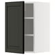 This image shows a black METOD wall cabinet with a white frame, featuring an adjustable shelf inside.