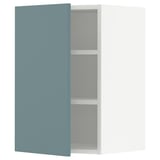A modern kitchen cabinet in turquoise with adjustable shelves and a sleek design.