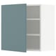 A turquoise METOD wall cabinet with an open door revealing an empty shelf inside.