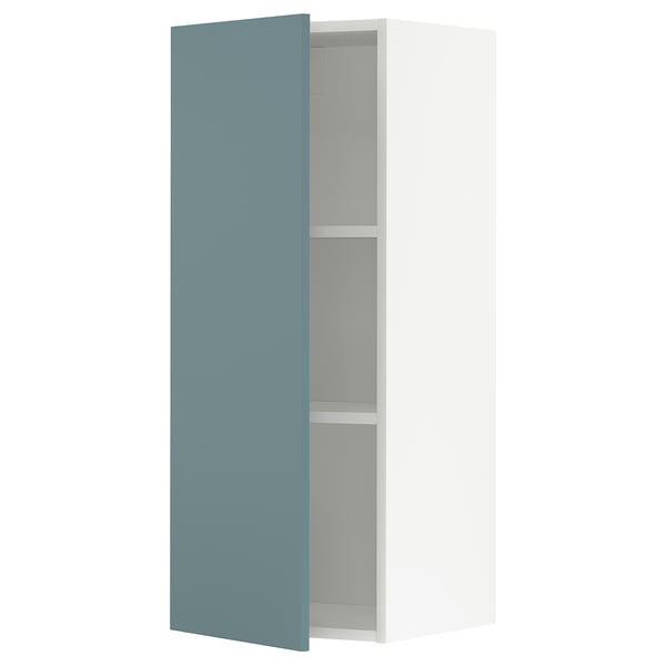 Turquoise blue METOD wall cabinet with two shelves.