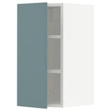 Ikea METOD kitchen cabinet in turquoise with adjustable shelf.