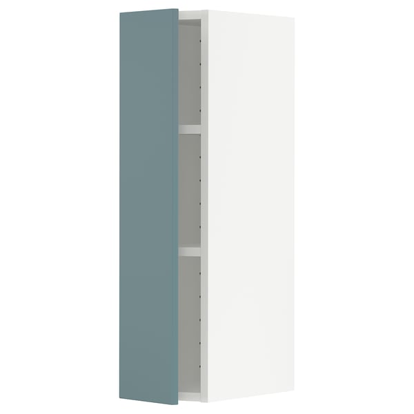 Vertical kitchen cabinet with turquoise door.