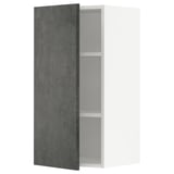 A modern kitchen cabinet with a dark grey concrete-effect door from the METOD system by ikea. It has a rectangular shape and an urban design.
