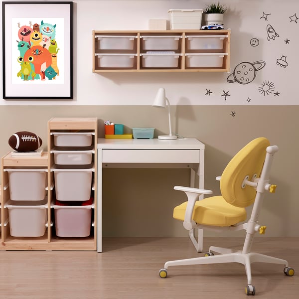 Study setup with MICKE white desk, yellow chair, art, storage.