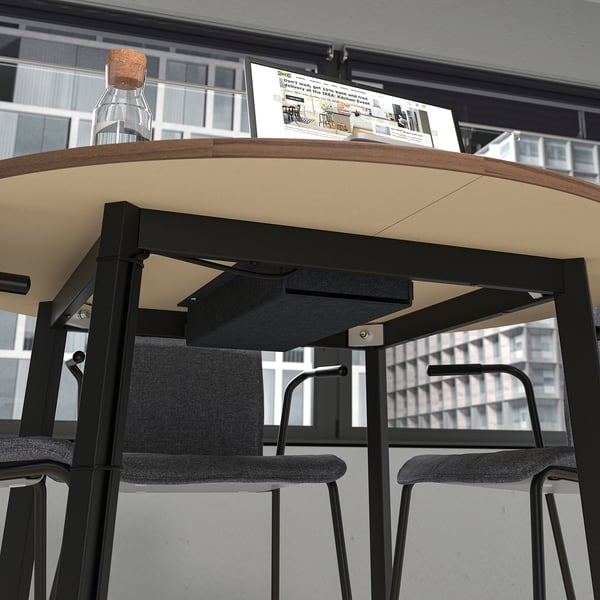 A round conference table with a built-in cable management tray, suitable for group discussions and small workspaces, ensuring organized meetings.