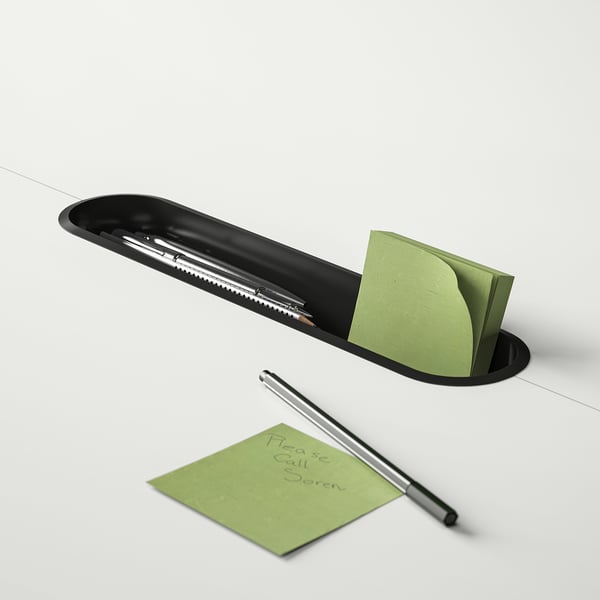 Black pen holder with green sticky notes and pen. One note reads please call boris.