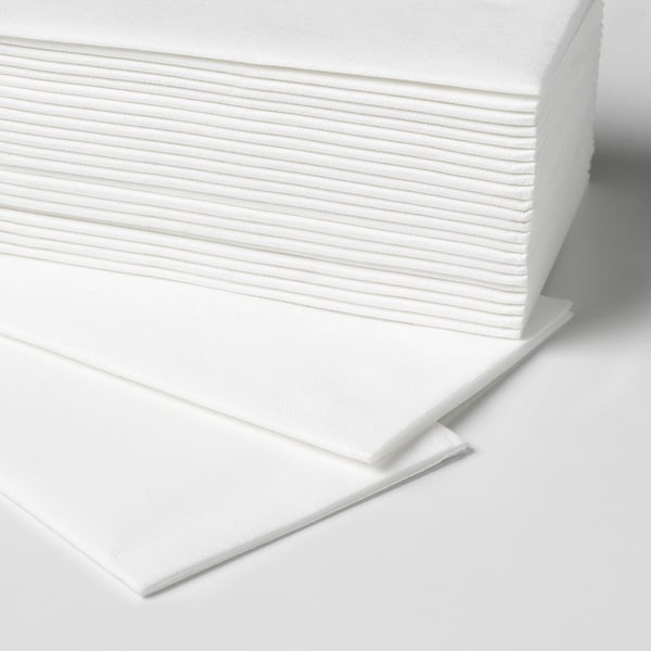 Stack of white cloth-like paper napkins neatly arranged, showing texture and quality.