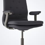 Dark office chair with adjustable armrests and tilt function.