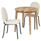 A NACKANÄS dining set with a round wooden table and two chairs in beige fabric.