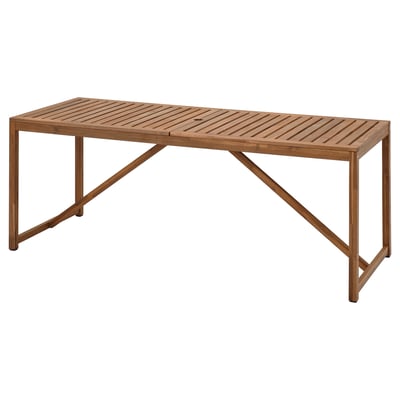 NÄMMARÖ brown wooden outdoor table with angular legs.