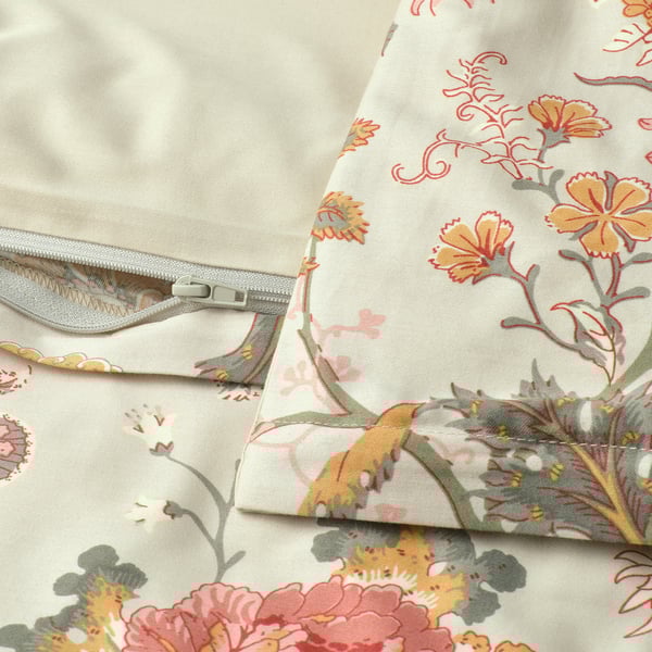 Floral duvet cover with zipper, showcasing intricate patterns in shades of orange, red, and green against a beige background.