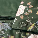 Floral dark green duvet with zipper closure, showcasing intricate floral patterns on one side.