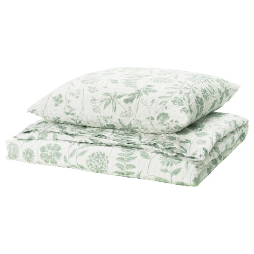 A green and white NÅLBJÖRNBÄR bedding set featuring leafy patterns, crafted from cotton and viscose for breathability and comfort.
