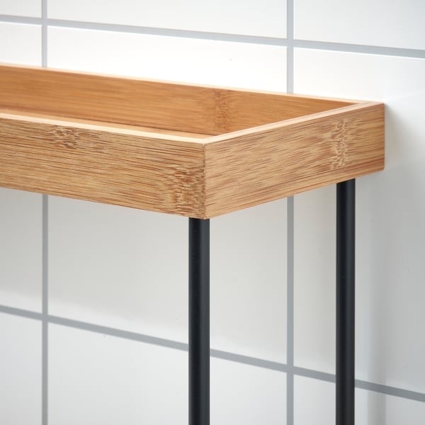 Modern bamboo tray on black metal stand. High-quality, stylish and functional kitchen organizer.