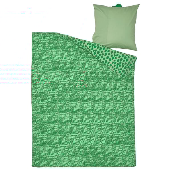 Green kids bedding set, featuring a playful crocodile print duvet and solid green pillow on white background.
