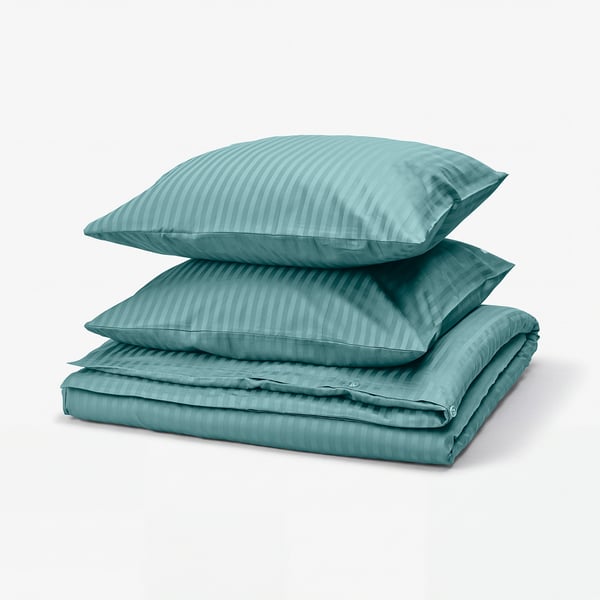 NATTJASMIN bedding set in teal with subtle stripes, made of soft cotton-lyocell blend, neatly folded.