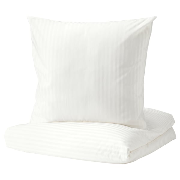 White bedding set with subtle stripes, made from cotton and lyocell for comfort.