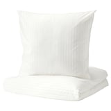 White bedding set with subtle stripes, made from cotton and lyocell for comfort.