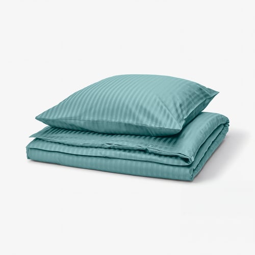 Turquoise striped bedding set, folded neatly, for a cosy and sleek look.