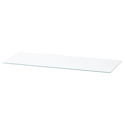 A rectangular glass top named NORDLI. Its clear and made of tempered glass, designed to protect and enhance a chest of drawers.