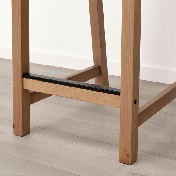 Modern wooden stool with sleek design and curved back, ideal for kitchen islands.