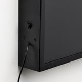 Modern black led wall lamp with visible cable and screws, minimalist design.