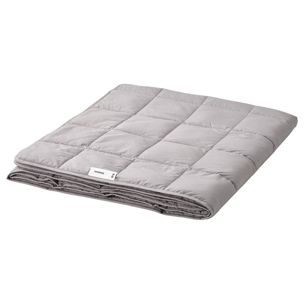 A grey ODONVIDE weighted blanket folded, made from recycled polyester and cotton, with a box-stitch pattern.