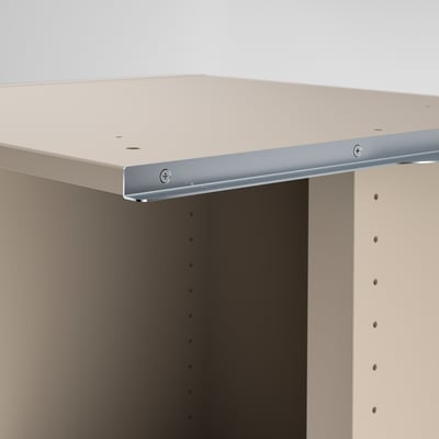 Close-up of neatly assembled shelf units edge, showcasing smooth, cream-colored finish and sturdy metal rail, highlighting craftsmanship and quality.