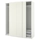 An ikea PAX white wardrobe with sliding doors and mesh drawers. The design is modern and minimalist.