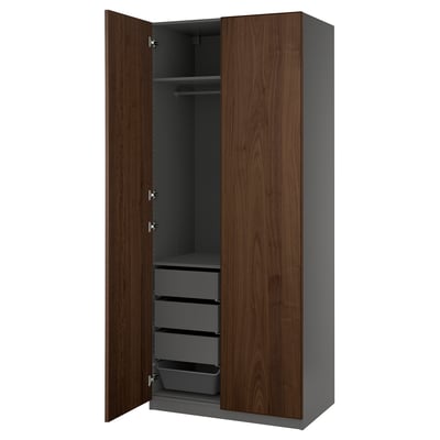 PAX wardrobe: tall, dark brown wooden doors, grey interior with shelves and drawers, modern design.