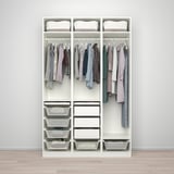 Organized closet with clothes on hangers, shelves, and mesh storage bins.