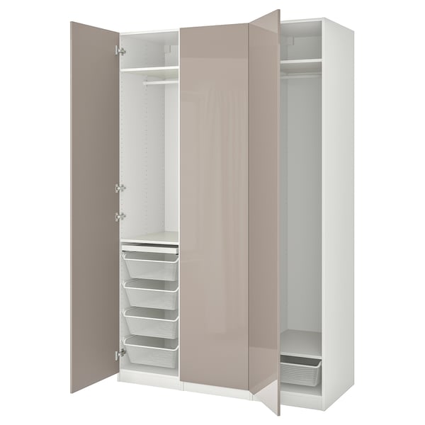 An open ikea PAX closet, featuring pink and white colors, with multiple storage compartments.