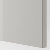 Modern white cabinet corner, smooth finish, clean lines.