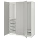 White PAX wardrobe displays storage: shelves, baskets, drawers.