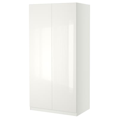 A white PAX wardrobe. It has a sleek, modern design with a glossy finish and soft-closing doors.