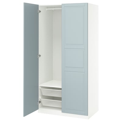An open blue and white PAX wardrobe with shelves and mesh baskets.