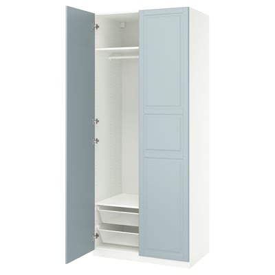 A light blue PAX wardrobe with one door open, revealing shelves and a rail inside.